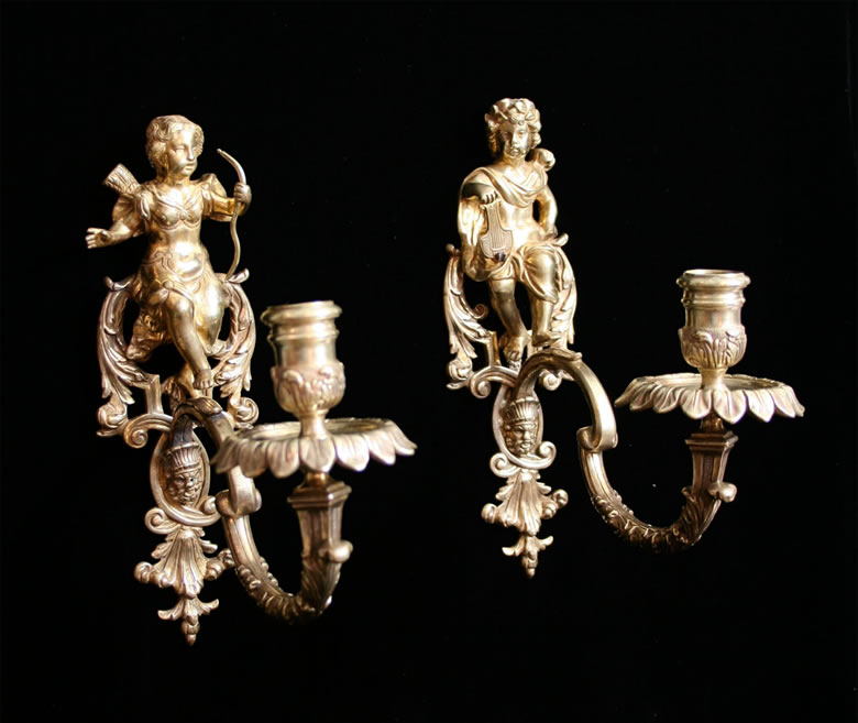 Unusual pair Rgence figural appliques depicting Venus and Apollo on reticulated wall plates