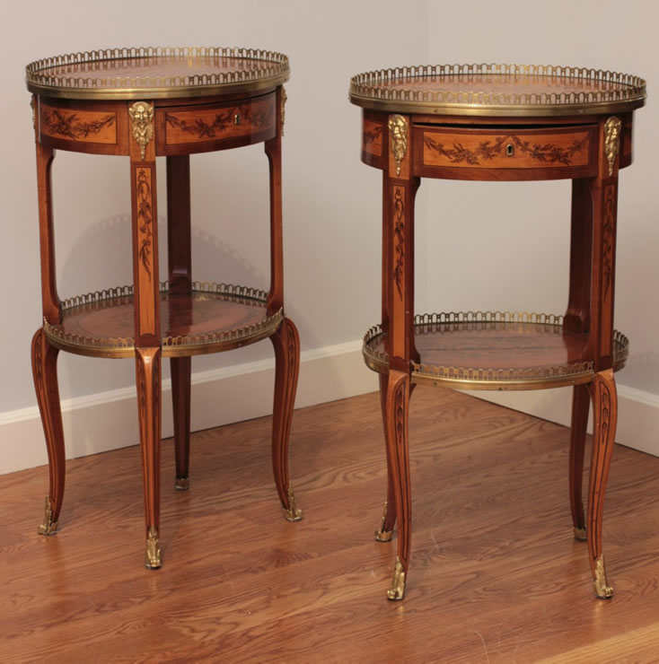 Pair of oval transitional marquetry tables signed Topino