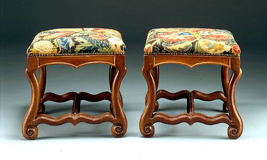 Pair of os de mouton Louis XIV walnut tabourets covered with old needlepoint