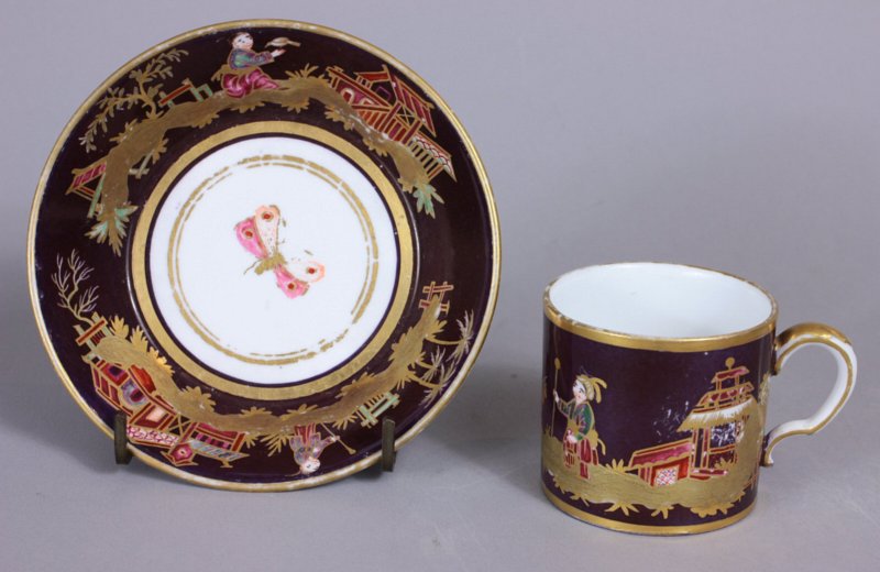 Small Sevres Chinoiserie purple ground cup and saucer