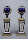 A pair of Sèvres miniature urns 