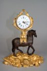 Early Louis XV clock supported by a horse.