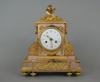 Louis XVI clock by Revel with exceptional two-colored gilding