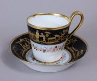 Sevres Empire black ground Chinoiserie cup and saucer