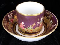 Small Sevres Chinoiserie purple ground cup and saucer